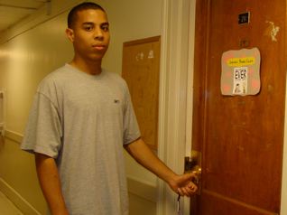 Jordan indulging his dad's need to capture every moment. Here he is about to open the door to his dorm room.